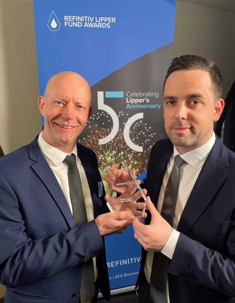 two men holding an award